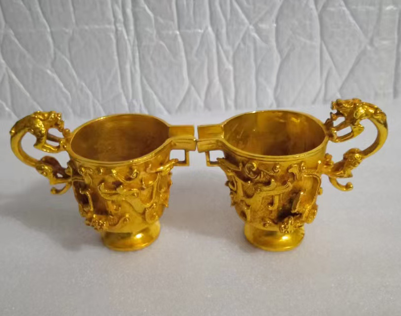 铜鎏金三足瑞兽酒杯-国博文物